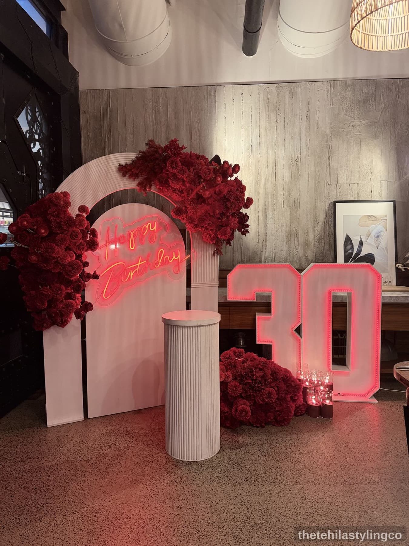Luxury floral backdrop with red roses, neon, and marquee lighting